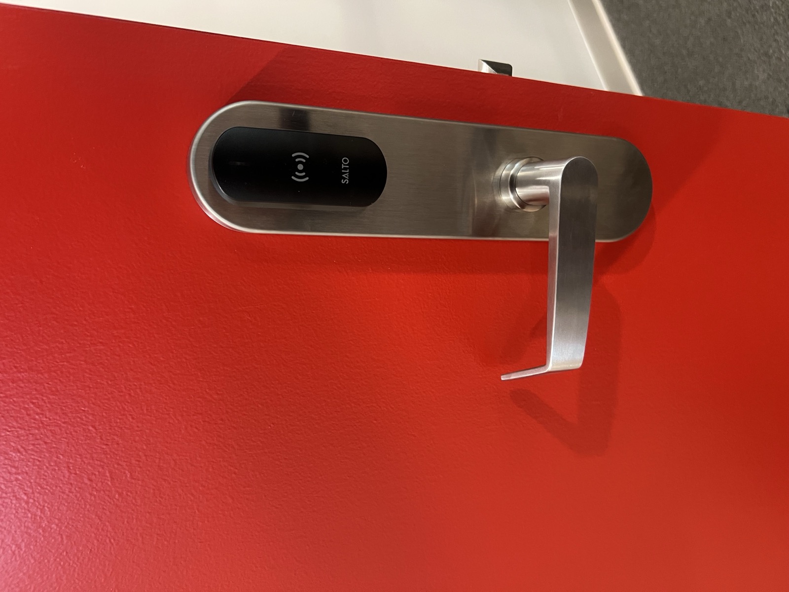 Commercial electronic access control lock installed on a secured interior door