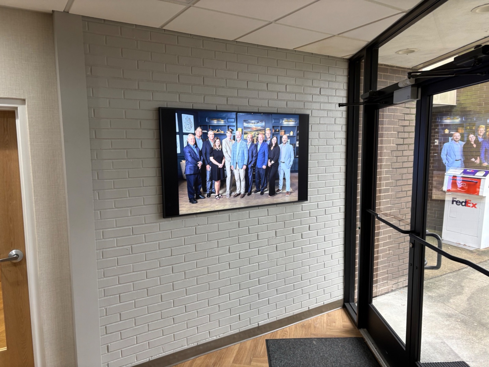 Integrated commercial building technology at a finished lobby entrance