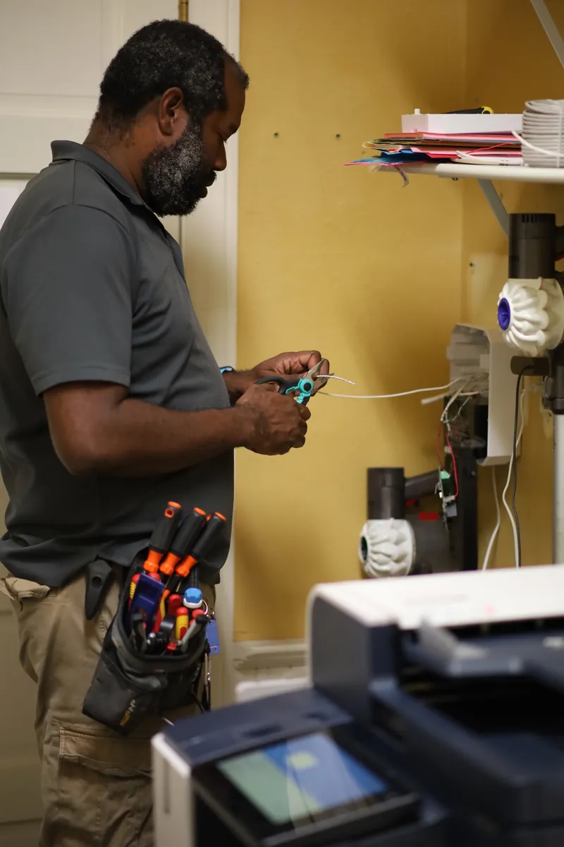 FM Tech technician installing a commercial alarm system