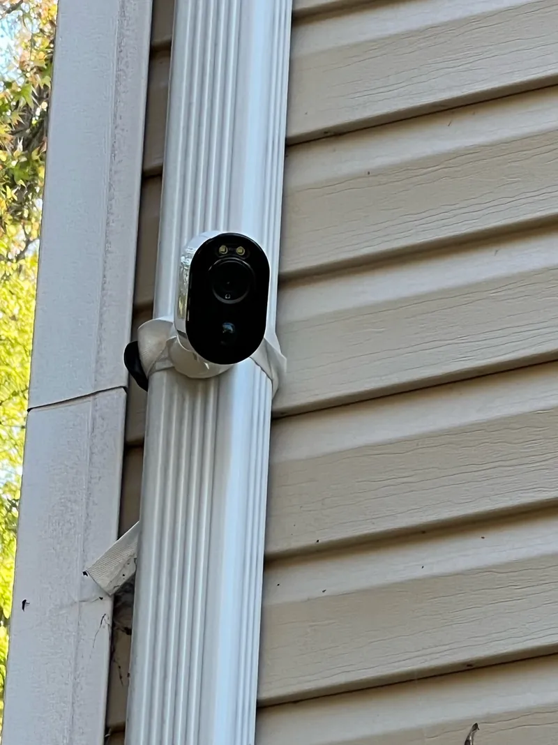 Surveillance camera installed on the exterior of a residential property