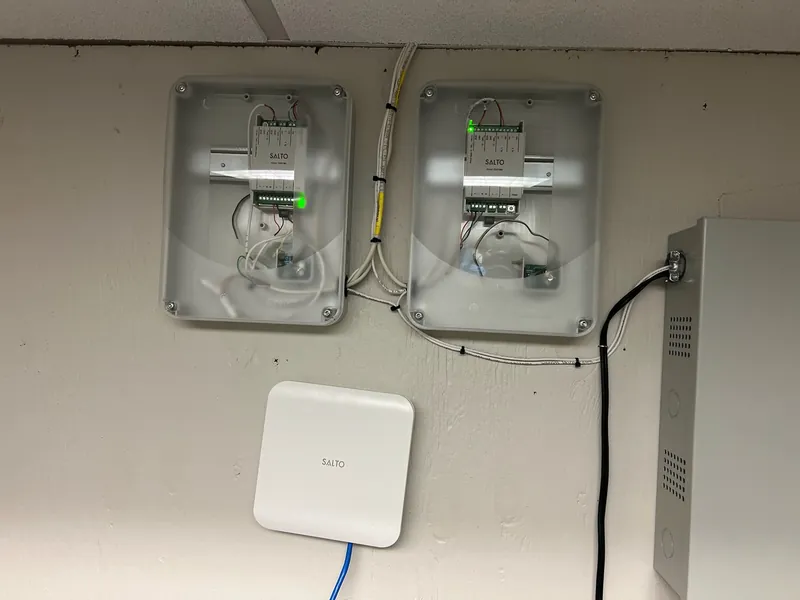 SALTO access control door controller installed on a commercial entrance